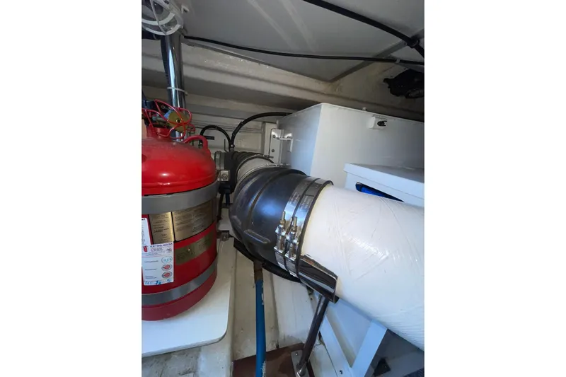 Peponi II Yacht Photos Pics Engine room of 2008 Grand Banks 47 Heritage EU with fire extinguisher and ventilation system.