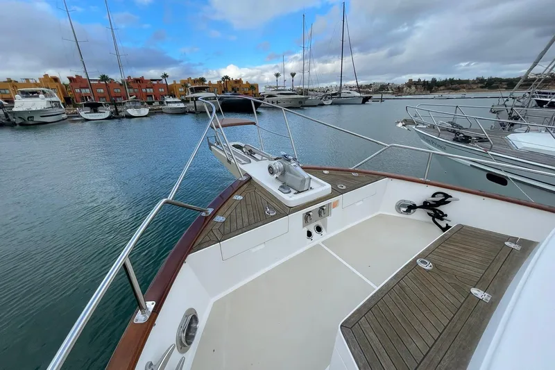 Peponi II Yacht Photos Pics Bow view of 2008 Grand Banks 47 Heritage EU yacht in marina setting.