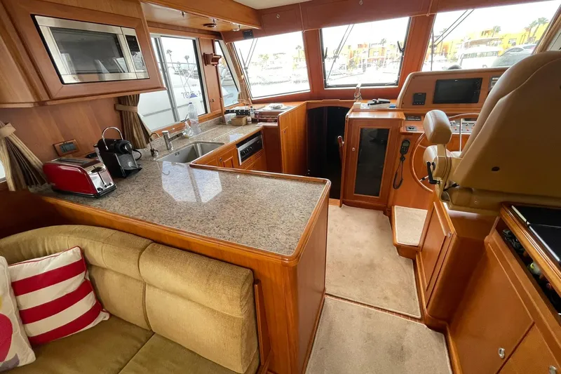 Peponi II Yacht Photos Pics Luxurious interior of 2008 Grand Banks 47 Heritage EU yacht with modern kitchen amenities.