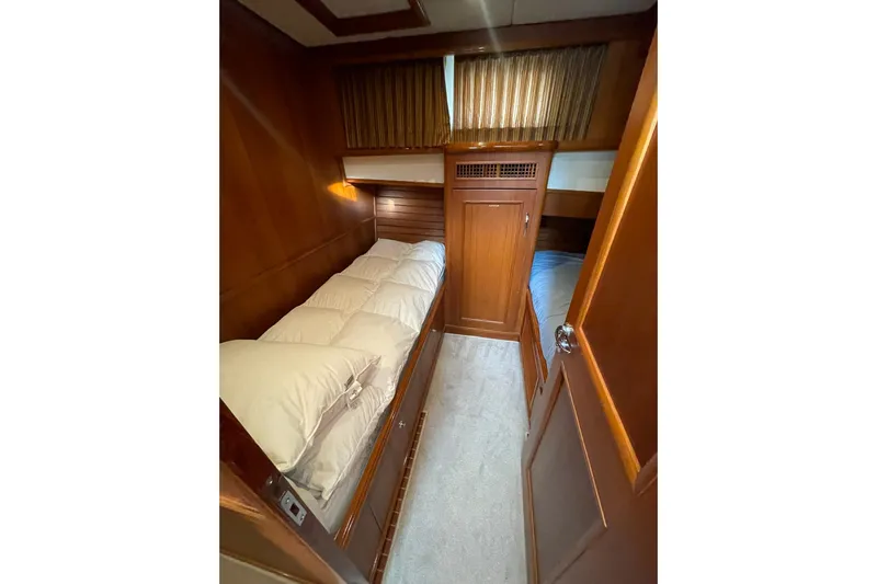 Peponi II Yacht Photos Pics Cozy cabin interior of 2008 Grand Banks 47 Heritage EU yacht with wooden finishes.