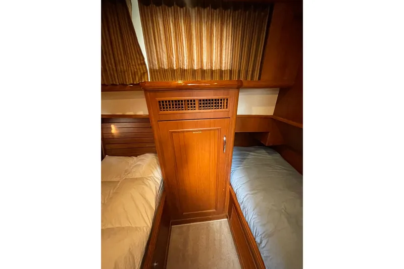 Peponi II Yacht Photos Pics 2008 Grand Banks 47 Heritage EU cabin with wooden cabinetry and twin beds.