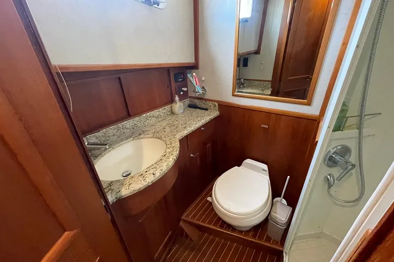 Peponi II Yacht Photos Pics Bathroom interior of 2008 Grand Banks 47 Heritage EU yacht with granite countertop and shower.