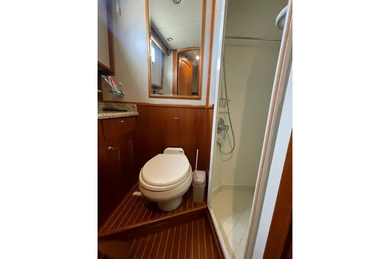 Peponi II Yacht Photos Pics Luxurious bathroom in 2008 Grand Banks 47 Heritage EU yacht with shower and wooden accents.