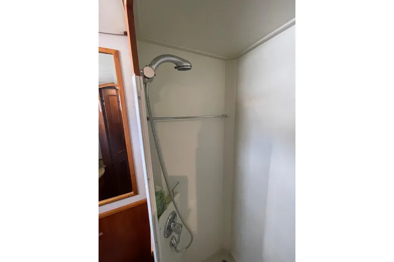 Peponi II Yacht Photos Pics Shower area in 2008 Grand Banks 47 Heritage EU yacht, featuring modern fixtures.