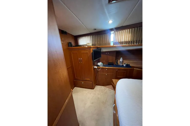 Peponi II Yacht Photos Pics Interior cabin of 2008 Grand Banks 47 Heritage EU yacht, featuring wood cabinetry and cozy decor.