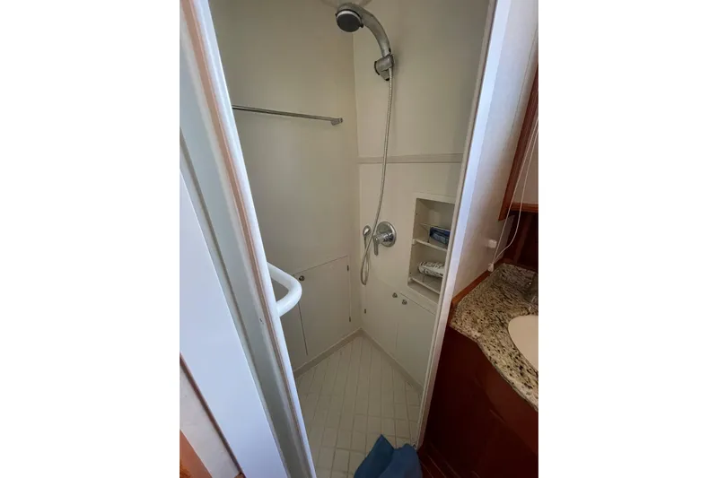 Peponi II Yacht Photos Pics Shower area in 2008 Grand Banks 47 Heritage EU yacht, featuring modern fixtures and storage.
