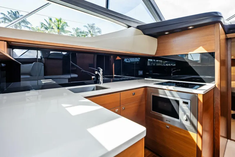 Zefa Yacht Photos Pics Modern kitchen interior on 2019 Princess 43 Flybridge yacht with sleek design and appliances.