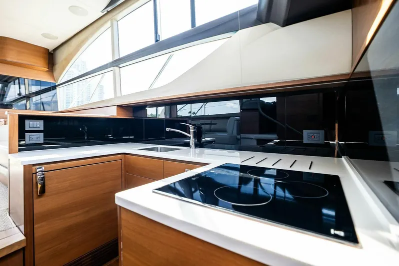 Zefa Yacht Photos Pics Luxurious kitchen interior of 2019 Princess 43 Flybridge yacht with modern appliances.