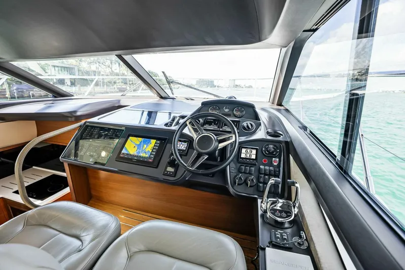 Zefa Yacht Photos Pics 2019 Princess 43 Flybridge yacht cockpit with modern navigation equipment and leather seating.