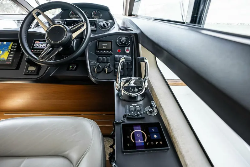 Zefa Yacht Photos Pics Interior helm of 2019 Princess 43 Flybridge yacht with modern controls and steering wheel.
