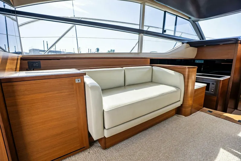 Zefa Yacht Photos Pics Luxurious interior of 2019 Princess 43 Flybridge yacht with elegant seating.