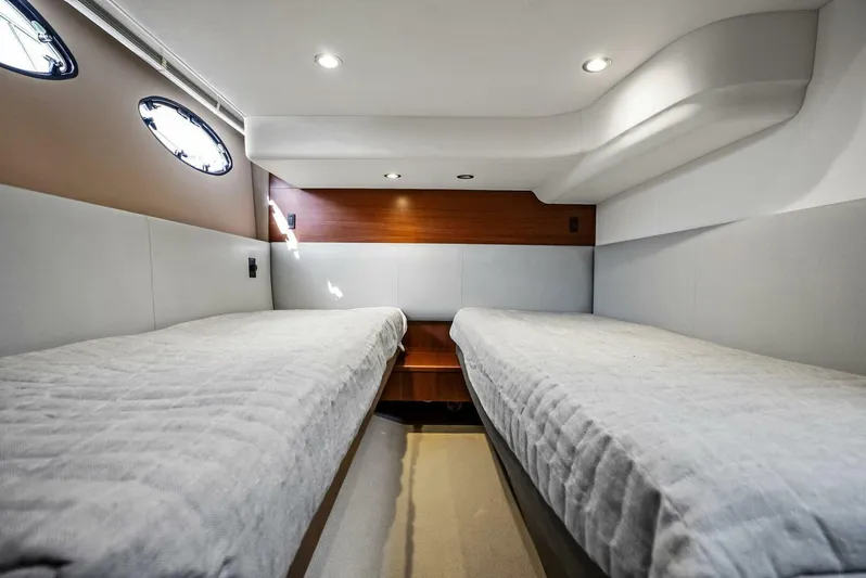 Zefa Yacht Photos Pics 2019 Princess 43 Flybridge cabin with twin beds and modern interior design.