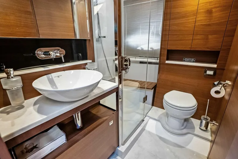 Zefa Yacht Photos Pics Luxurious bathroom in 2019 Princess 43 Flybridge yacht with modern fixtures and wood accents.