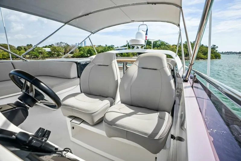 Zefa Yacht Photos Pics 2019 Princess 43 Flybridge yacht interior with plush seating and scenic water view.