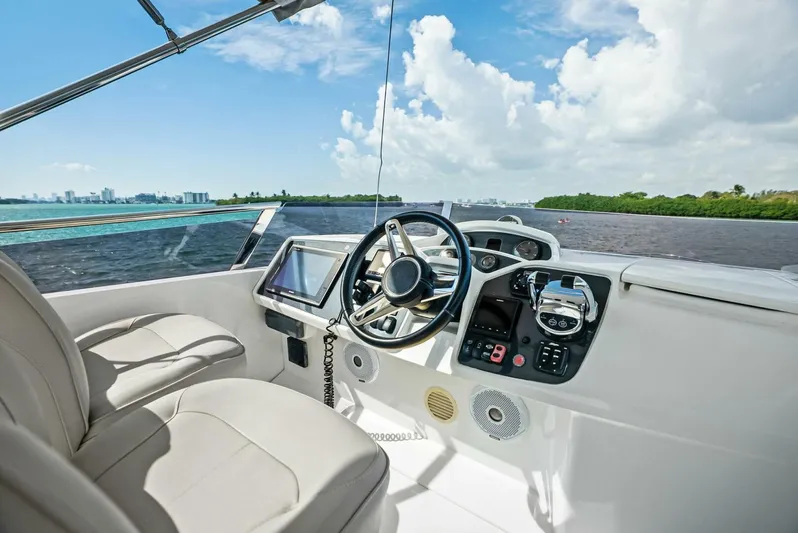 Zefa Yacht Photos Pics Flybridge helm of 2019 Princess 43 yacht with scenic water view.