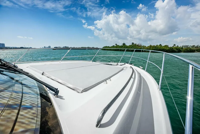 Zefa Yacht Photos Pics 2019 Princess 43 Flybridge yacht cruising on clear blue waters under a sunny sky.