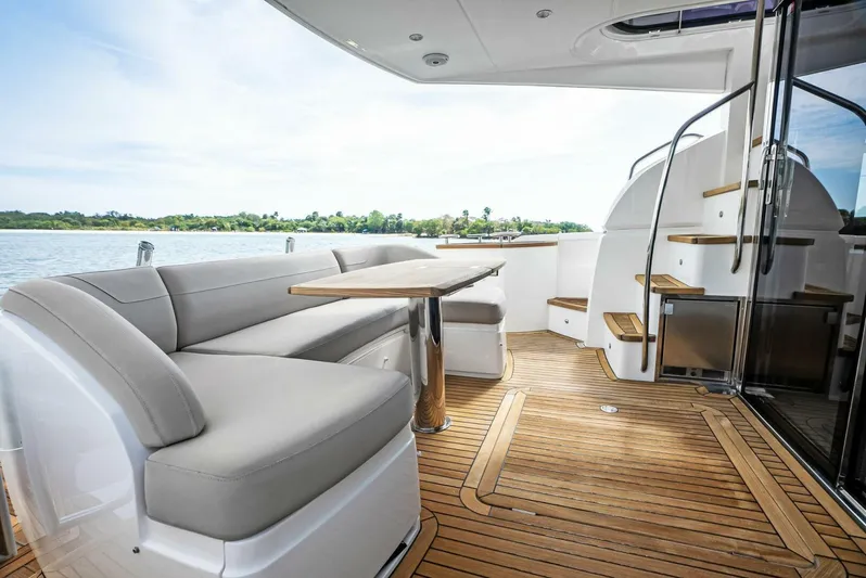 Zefa Yacht Photos Pics Luxurious 2019 Princess 43 Flybridge yacht interior with elegant seating and wooden flooring.