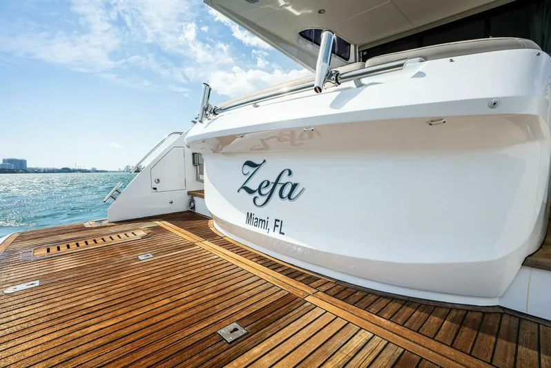 Zefa Yacht Photos Pics 2019 Princess 43 Flybridge yacht with wooden deck, docked in Miami, FL.