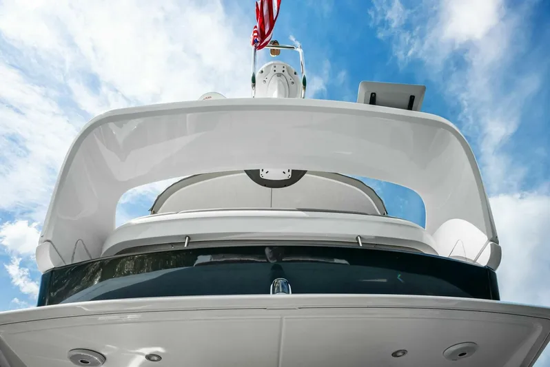 Zefa Yacht Photos Pics 2019 Princess 43 Flybridge yacht against a blue sky backdrop.