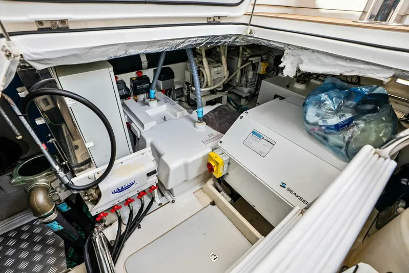 Zefa Yacht Photos Pics Engine room of 2019 Princess 43 Flybridge yacht, showcasing mechanical components and equipment.