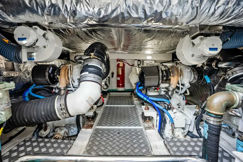 Zefa Yacht Photos Pics Engine room of 2019 Princess 43 Flybridge yacht, showcasing dual engines and mechanical components.