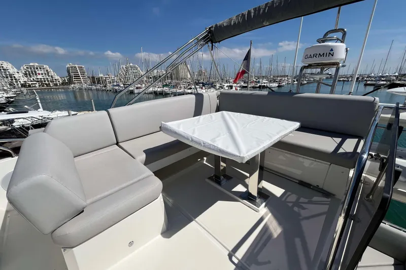  Yacht Photos Pics Luxurious 2023 Prestige 520 yacht with elegant seating and marina view.