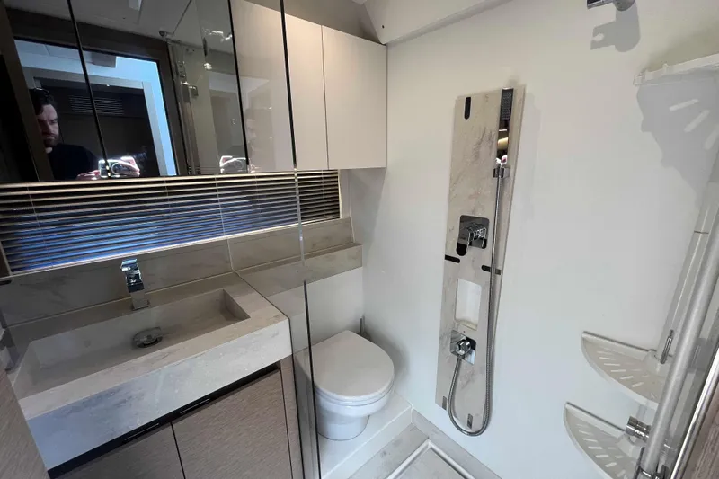  Yacht Photos Pics Modern bathroom in 2023 Prestige 520 yacht with sleek fixtures and elegant design.