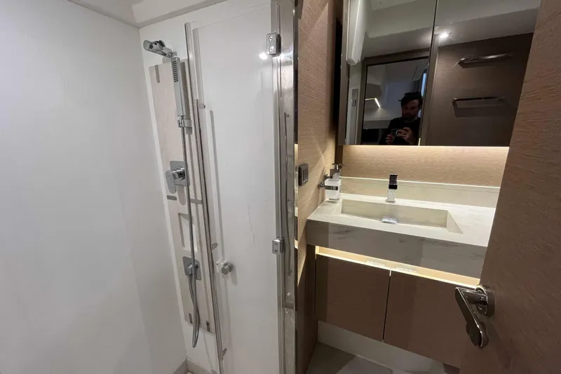  Yacht Photos Pics Modern bathroom in 2023 Prestige 520 yacht with sleek shower and vanity.