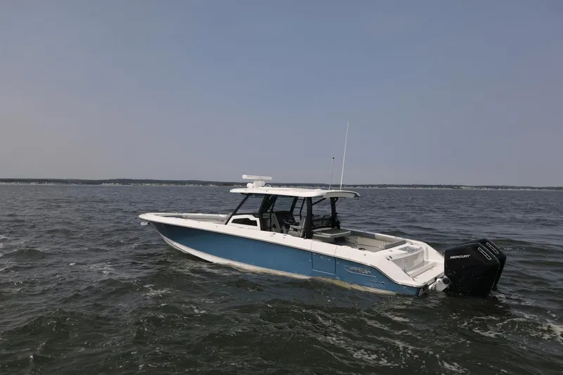  Yacht Photos Pics 2025 Boston Whaler 380 Outrage boat cruising on open water.