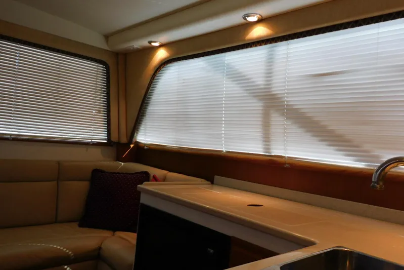 Mishap Yacht Photos Pics Interior of 1999 Cabo 35 Flybridge Sportfisher with blinds and seating area.