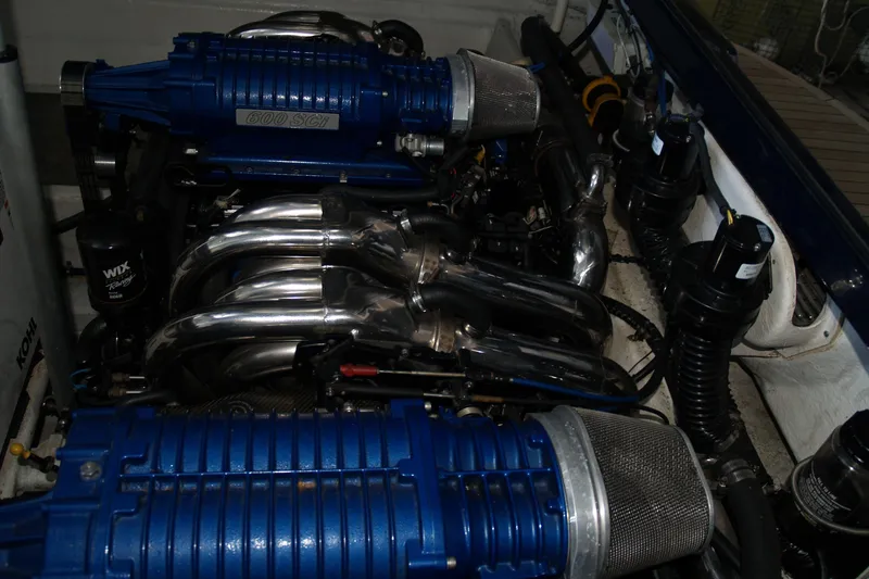Speedbird Yacht Photos Pics Engine compartment of a 2012 Hunton XRS 43 with blue 600 SCI components.