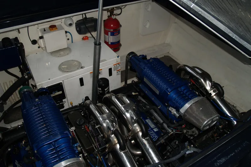 Speedbird Yacht Photos Pics Engine compartment of 2012 Hunton XRS 43 with dual blue supercharged engines.