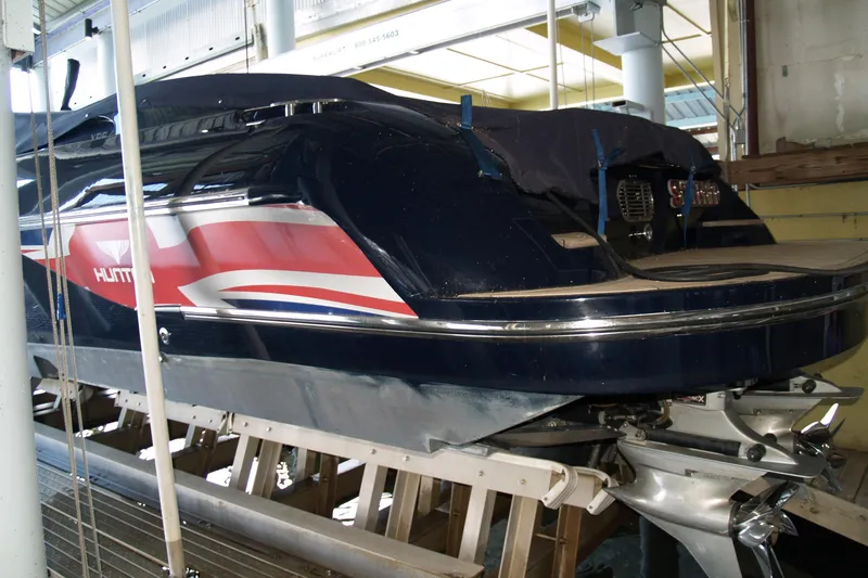 Speedbird Yacht Photos Pics 2012 Hunton XRS 43 boat in storage, featuring sleek design and vibrant graphics.