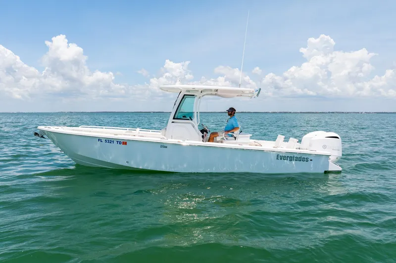 Yacht Photos Pics 2021 Everglades 273 Center Console boat on calm ocean waters under a clear sky.