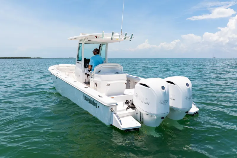  Yacht Photos Pics 2021 Everglades 273 Center Console boat on open water, featuring dual Yamaha engines.