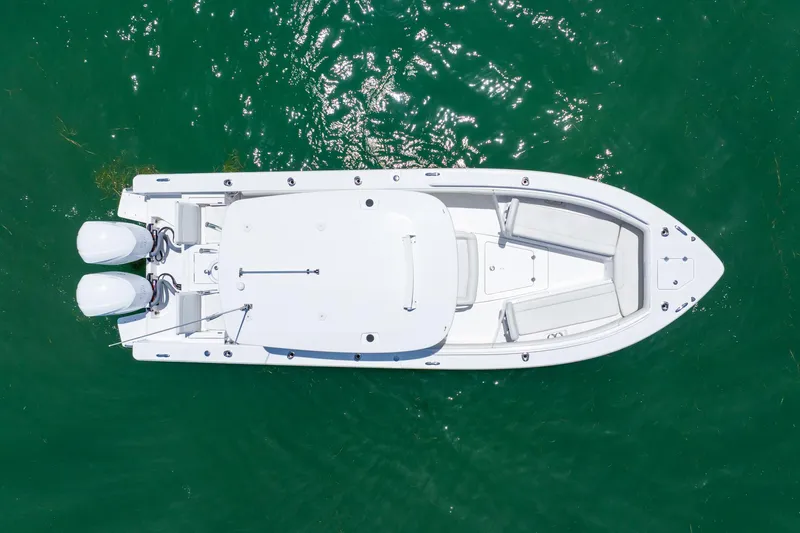  Yacht Photos Pics Overhead view of 2021 Everglades 273 Center Console boat on clear water.