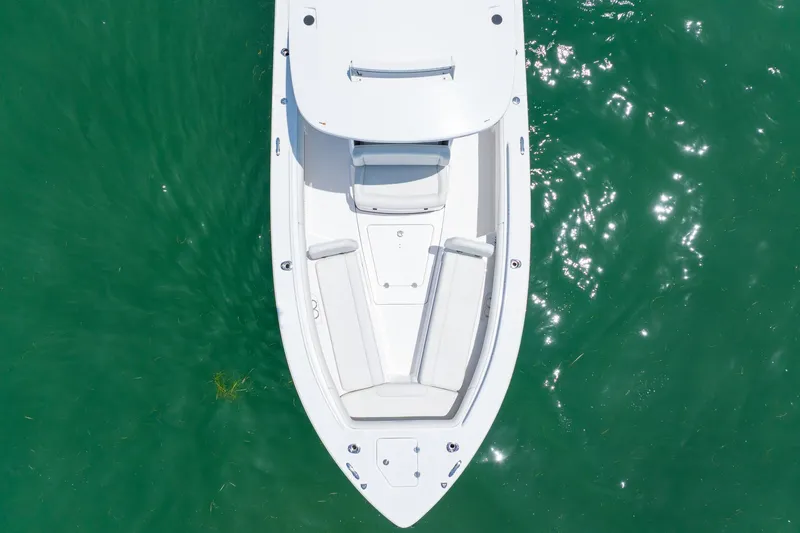  Yacht Photos Pics Overhead view of 2021 Everglades 273 Center Console boat on clear green water.
