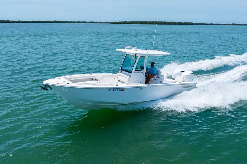  Yacht Photos Pics 2021 Everglades 273 Center Console boat cruising on open water.