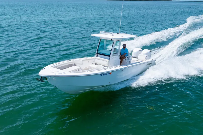  Yacht Photos Pics 2021 Everglades 273 Center Console boat cruising on clear blue water.