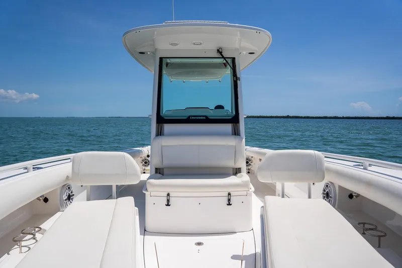  Yacht Photos Pics 2021 Everglades 273 Center Console boat on open water, clear sky.
