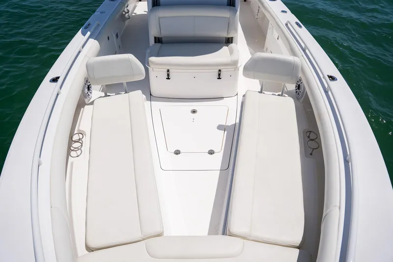  Yacht Photos Pics 2021 Everglades 273 Center Console boat interior with white seating and spacious deck.
