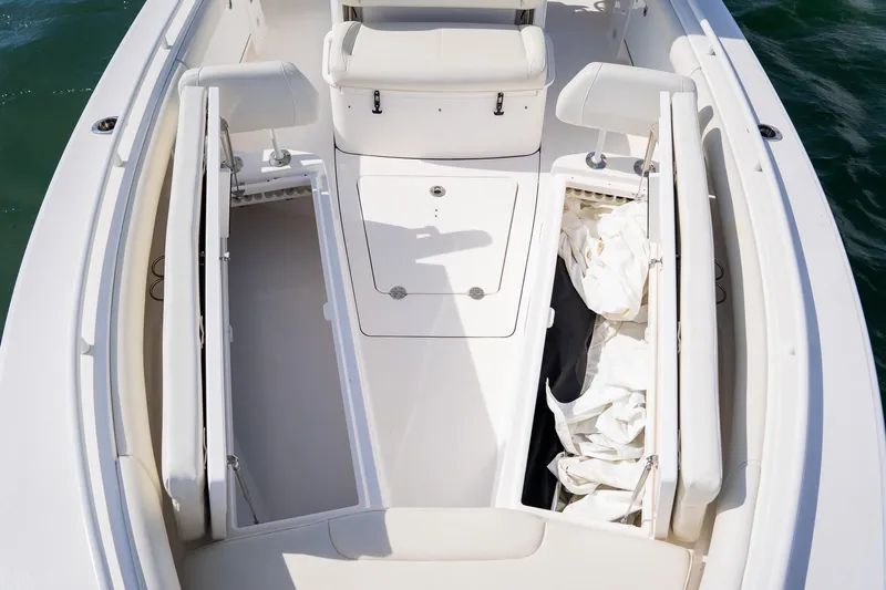  Yacht Photos Pics 2021 Everglades 273 Center Console boat interior with storage compartments and seating.