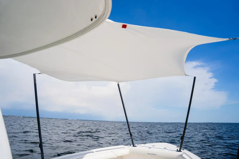  Yacht Photos Pics Everglades 273 Center Console boat with sunshade on open water, 2021 model.