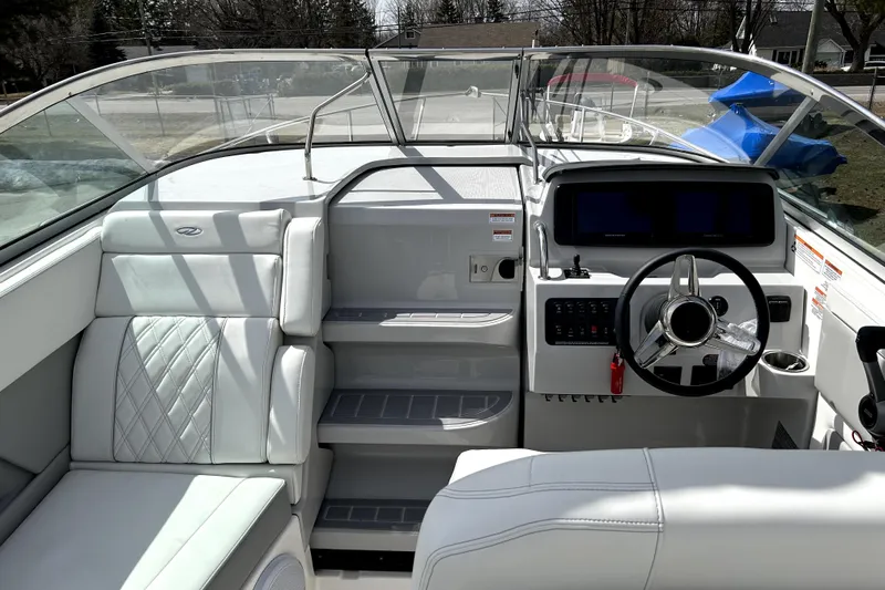  Yacht Photos Pics 2023 Regal 28 Express boat interior with modern helm and seating.