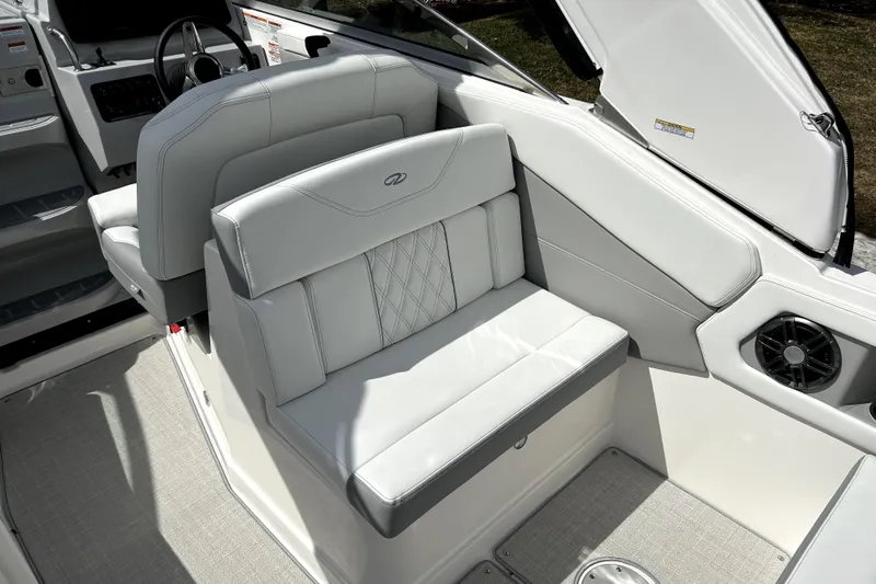  Yacht Photos Pics 2023 Regal 28 Express boat interior with luxurious seating and modern design.