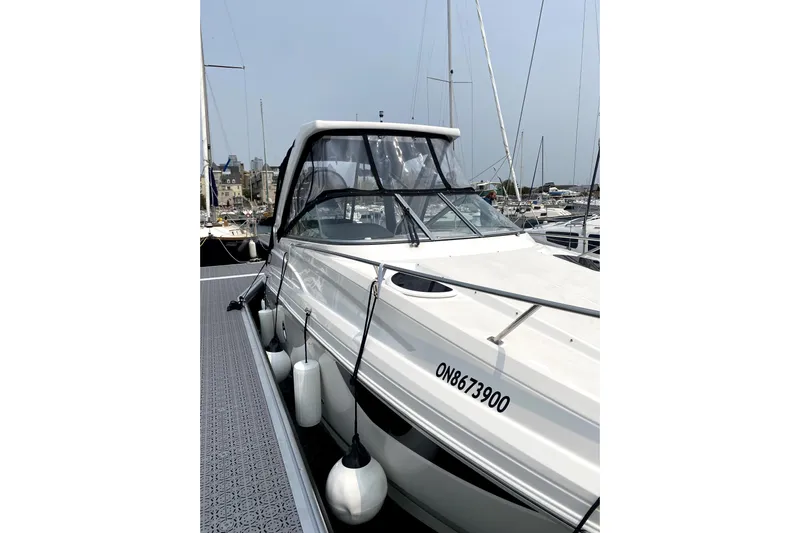  Yacht Photos Pics 2023 Regal 28 Express boat docked at marina with protective fenders.