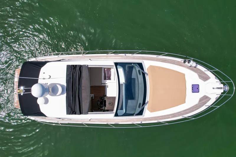 Above & Beyond Yacht Photos Pics Aerial view of 2016 Azimut 43 ATLANTIS yacht on green water.