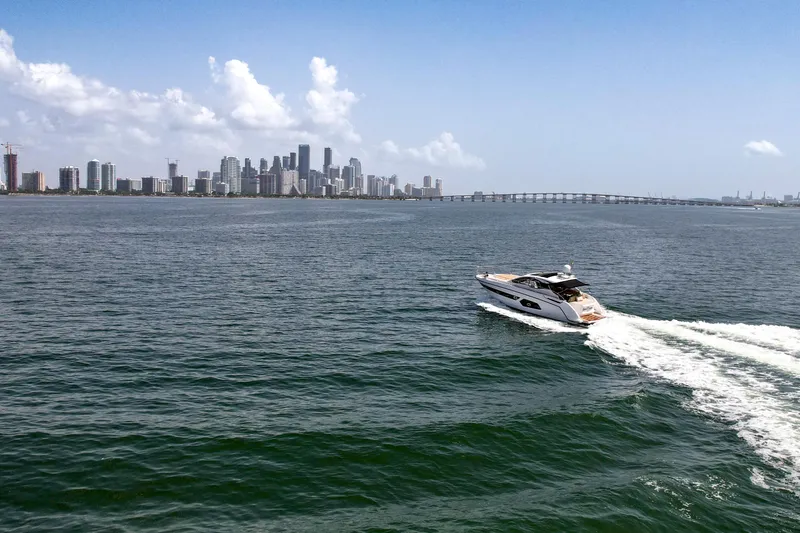 Above & Beyond Yacht Photos Pics Azimut 43 ATLANTIS 2016 yacht cruising near city skyline and bridge.