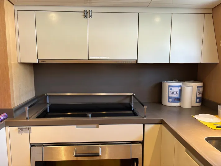 Lady Ab Yacht Photos Pics Modern kitchen in 2013 Sanlorenzo SL94 yacht with sleek cabinetry and stainless steel appliances.