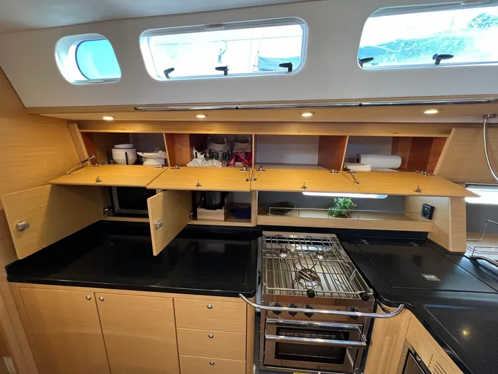 Xaca Yacht Photos Pics Modern kitchen in 2015 X-Yachts Xp 55 sailboat with open cabinets and sleek design.